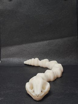 Sleek-Eyed Bone Snake (Medium Tightness) - Articulated Snap-Flex Fidget 3d model