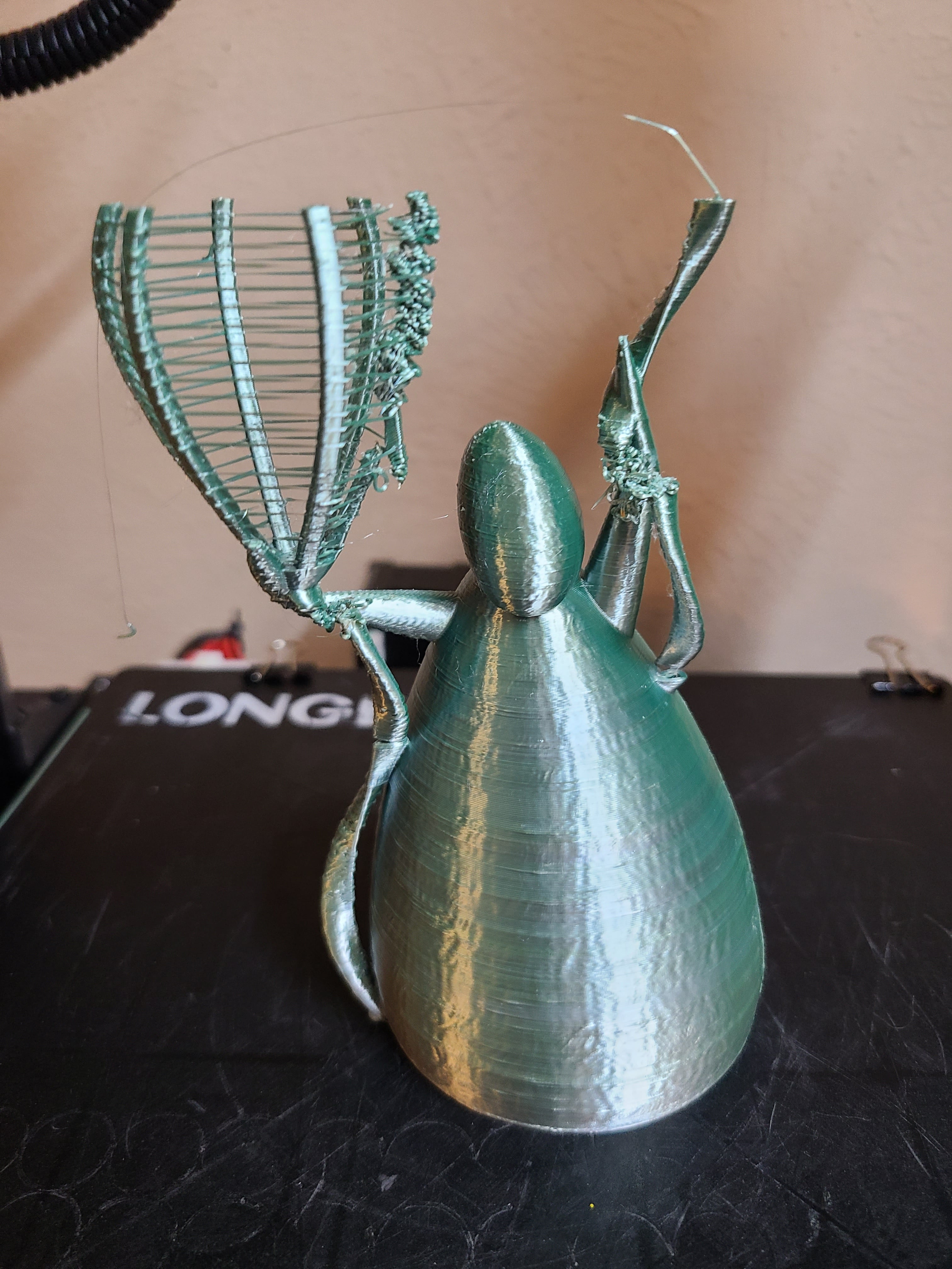 The circular motion of printing the walls on the ribbons created too much stress and broke the ribbons loose. It looks like the same thing happened on the inner rib of the balloon. I sliced at 0.2mm, 20% infill, and 2 walls with a 0.4mm nozzle.