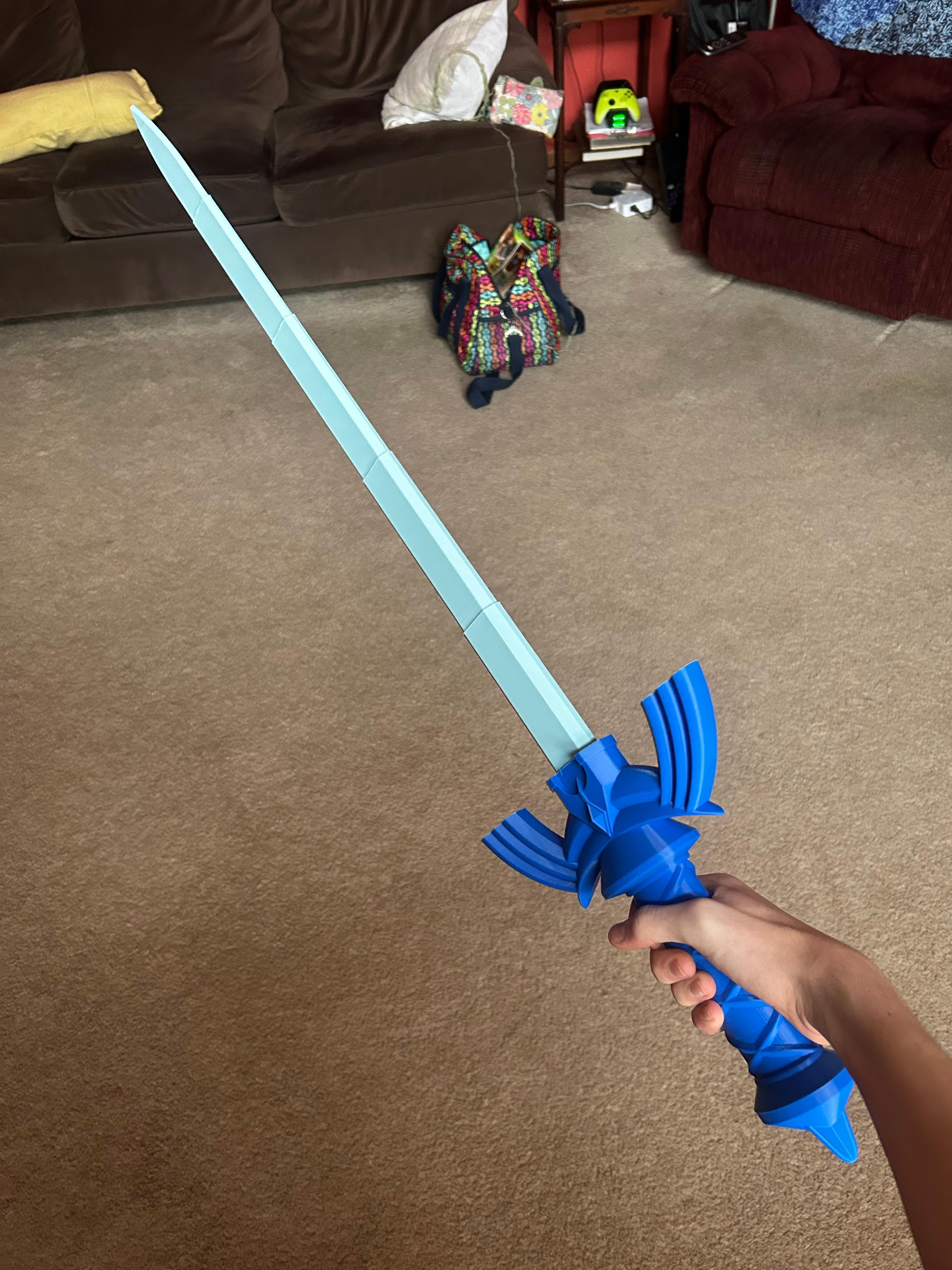 Collapsing Master Sword (Dual Extrusion) - I really like how this turned out! I used generic blue PLA for the hilt and light blue Inland PLA for the blade. - 3d model