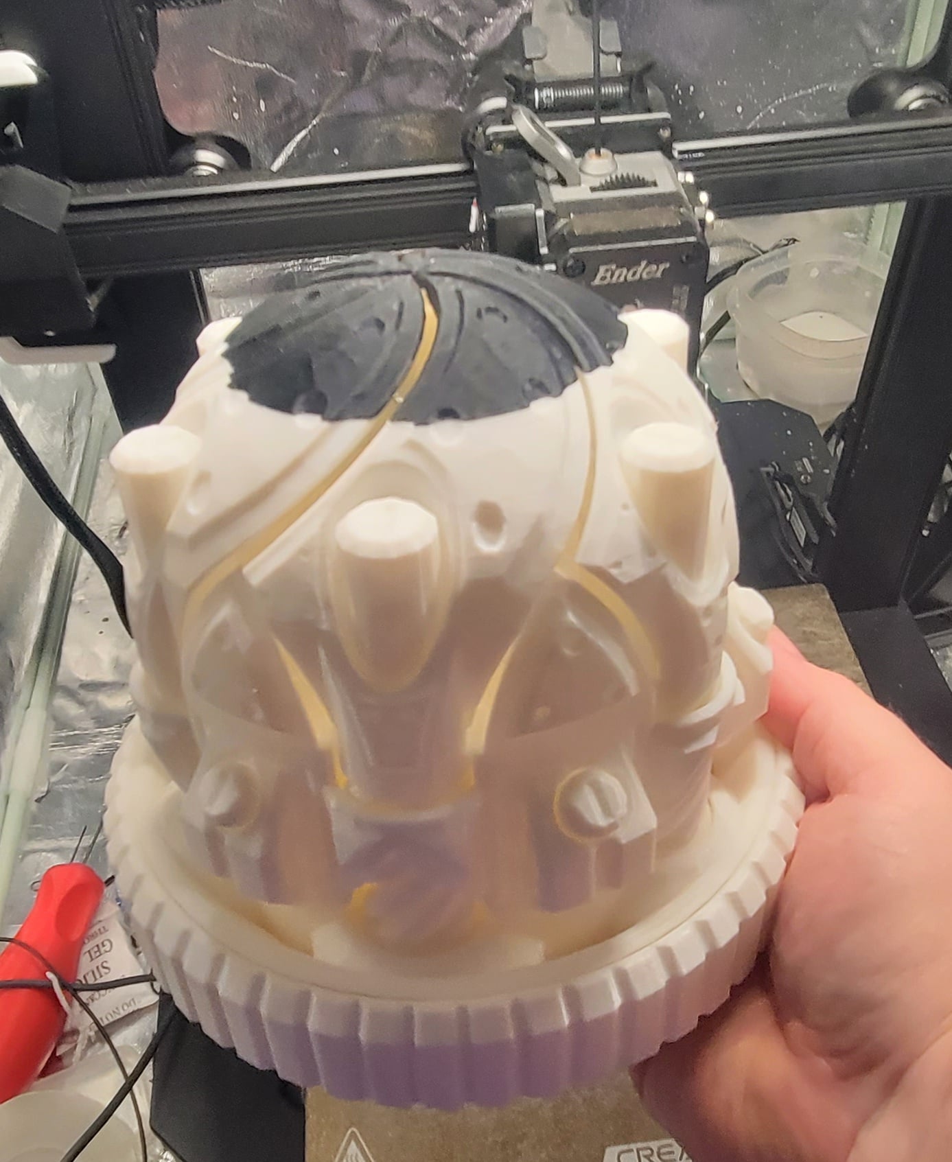 I ran out of white filament, and had to finish it up with black. But I love it! Took me a bit to get it to open, but haven't had a problem since. My nephew will love this for his D&D dice collection.