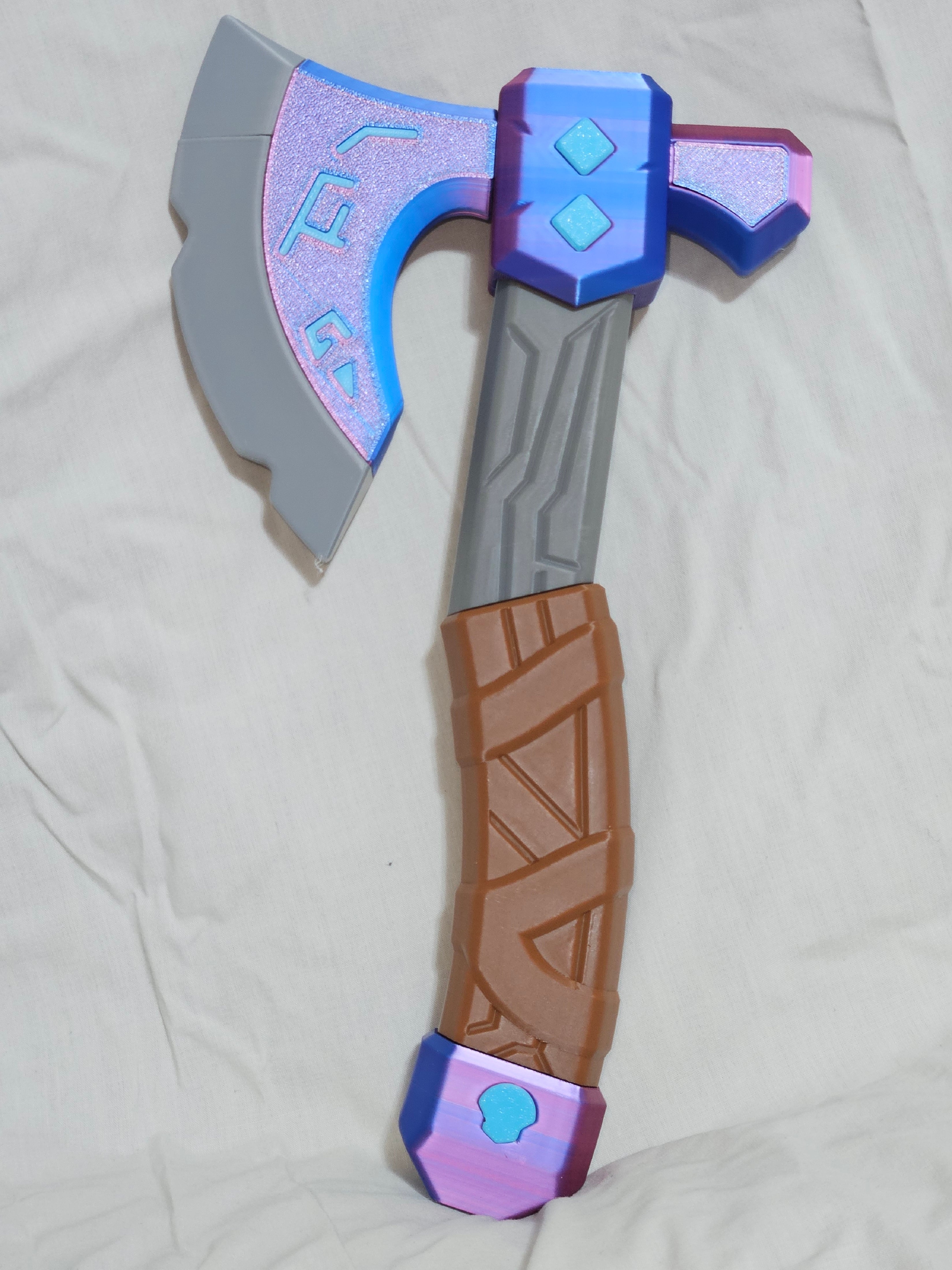 Shimmering with veins of pure power, this axe with smite legions of enemies and forever lock them in the ice and frost halls of Helheim!