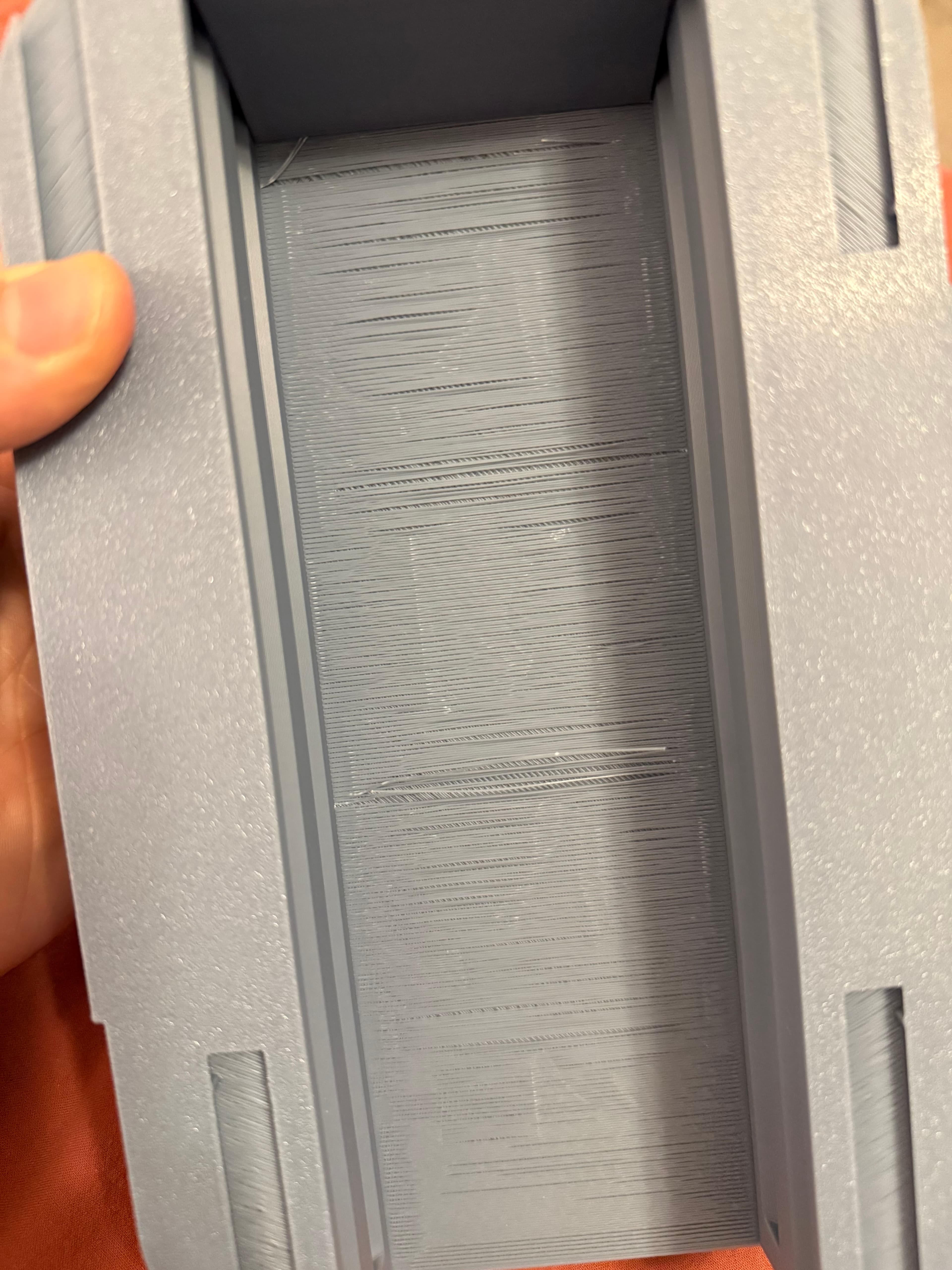 Pretty disappointed in the pot, I printed it twice; first time using the 3mf file without any changes, and the second time with the .97 bridge flow after reading through the comments.
Both end up as shown in the pictures. Wasted 500g of filament, not pleased with this at all. The stringing catches each time the leaf holder is opened and leads to at least 2-3 breaking off each time, making it harder to open over time.