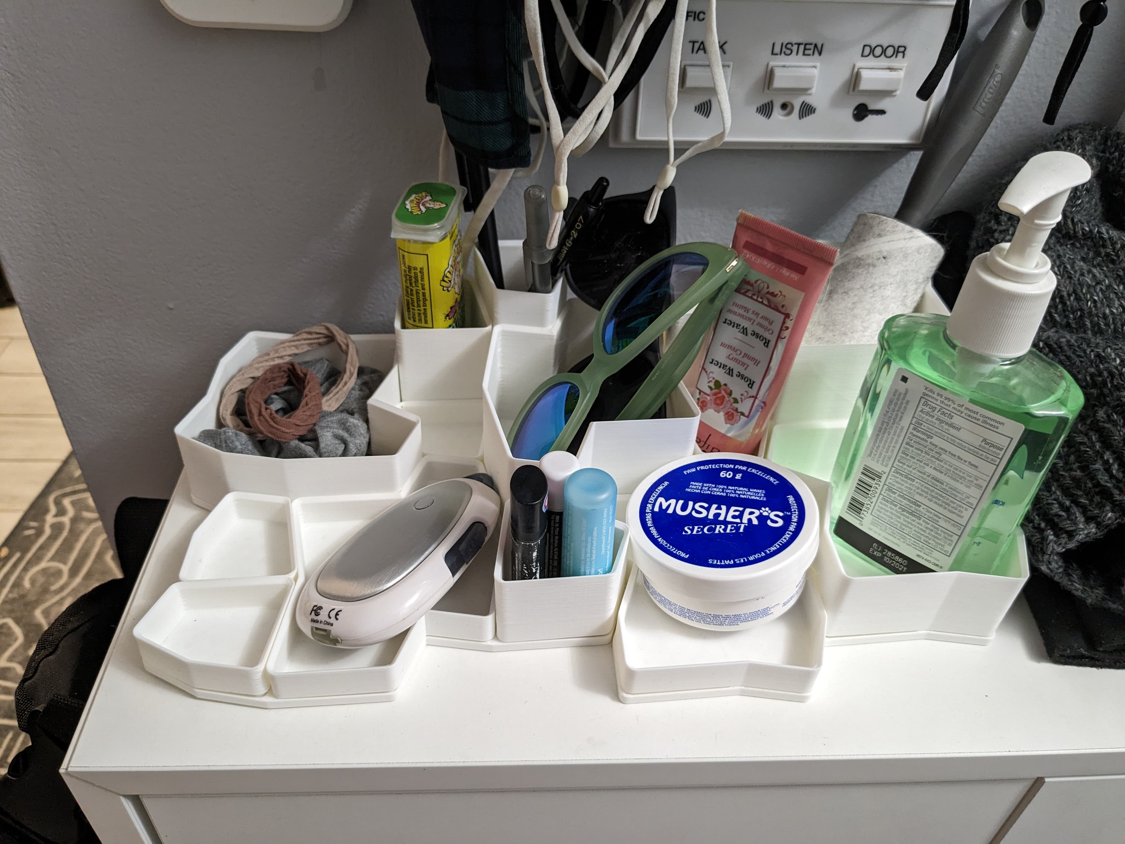 Great place to store all the little things I need by the front door that I'm always forgetting. A small command strip under just cups in each base keeps everything in place.
