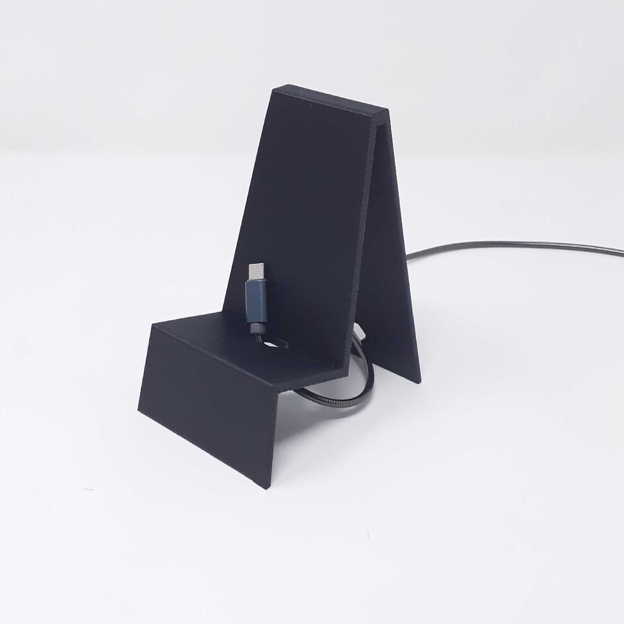 "Minimi" the phone stand with hole for charger 3d model