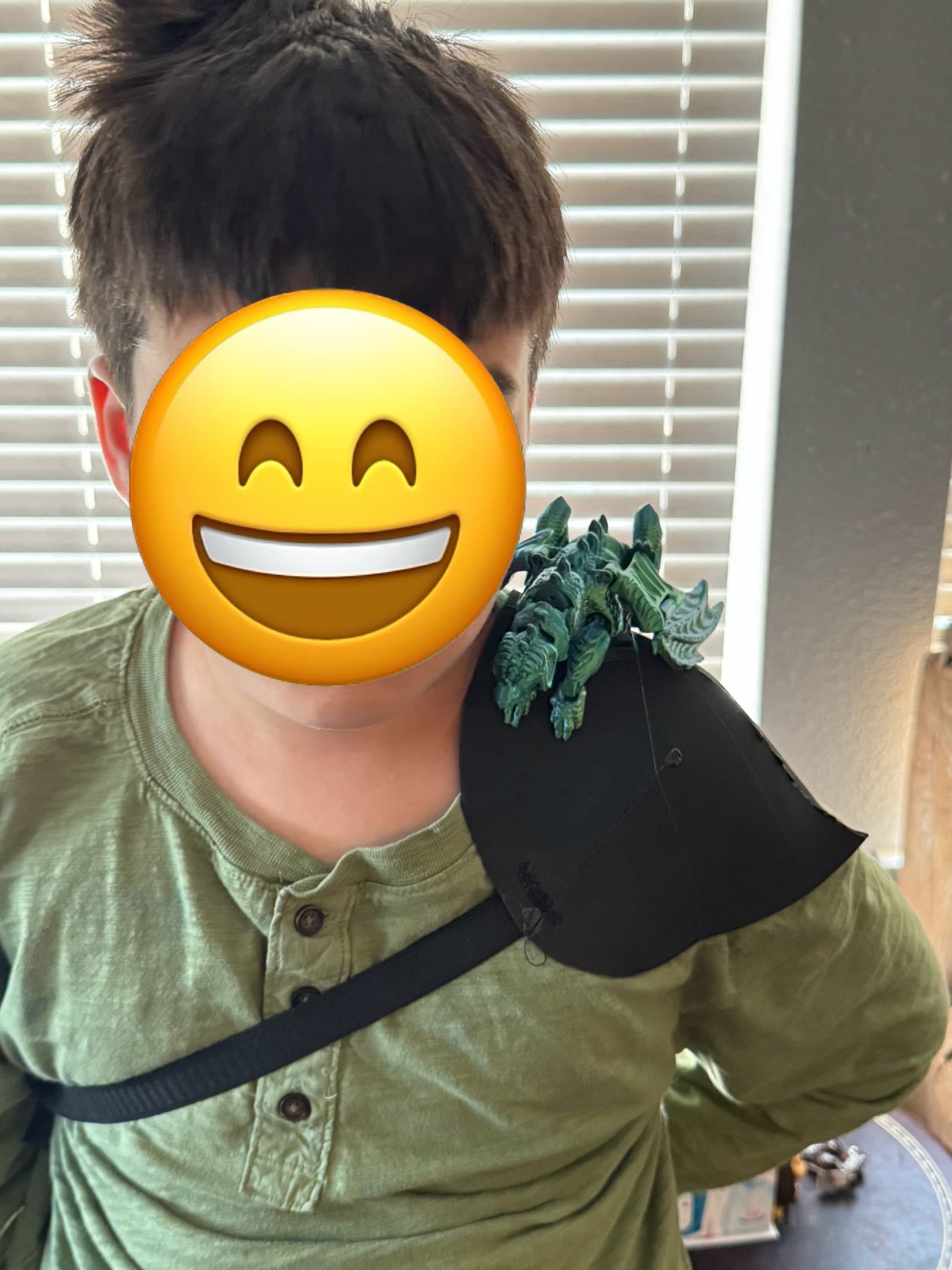 My kids love it so much! I scaled it done to 80% to fit a smaller shoulder which also allowed me to fit the entire dragon on one build plate and print it all at once with no supports! I attached the harness to a really basic bit of foam shoulder armor that I made so that it would blend in with their ren fair costumes.