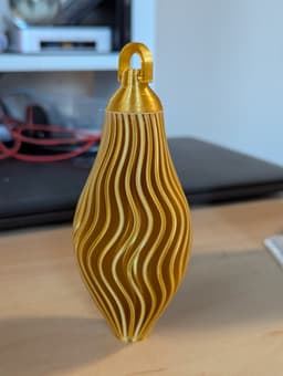 Body printed in Vase mode - 1h to print. Perfect except for the point which went wobbly. Cut off and it looks great anyway.
Cap and hook printed normally and hot glued to body.
Looks great - i will be printing a verity of these for this year's tree. 3d model