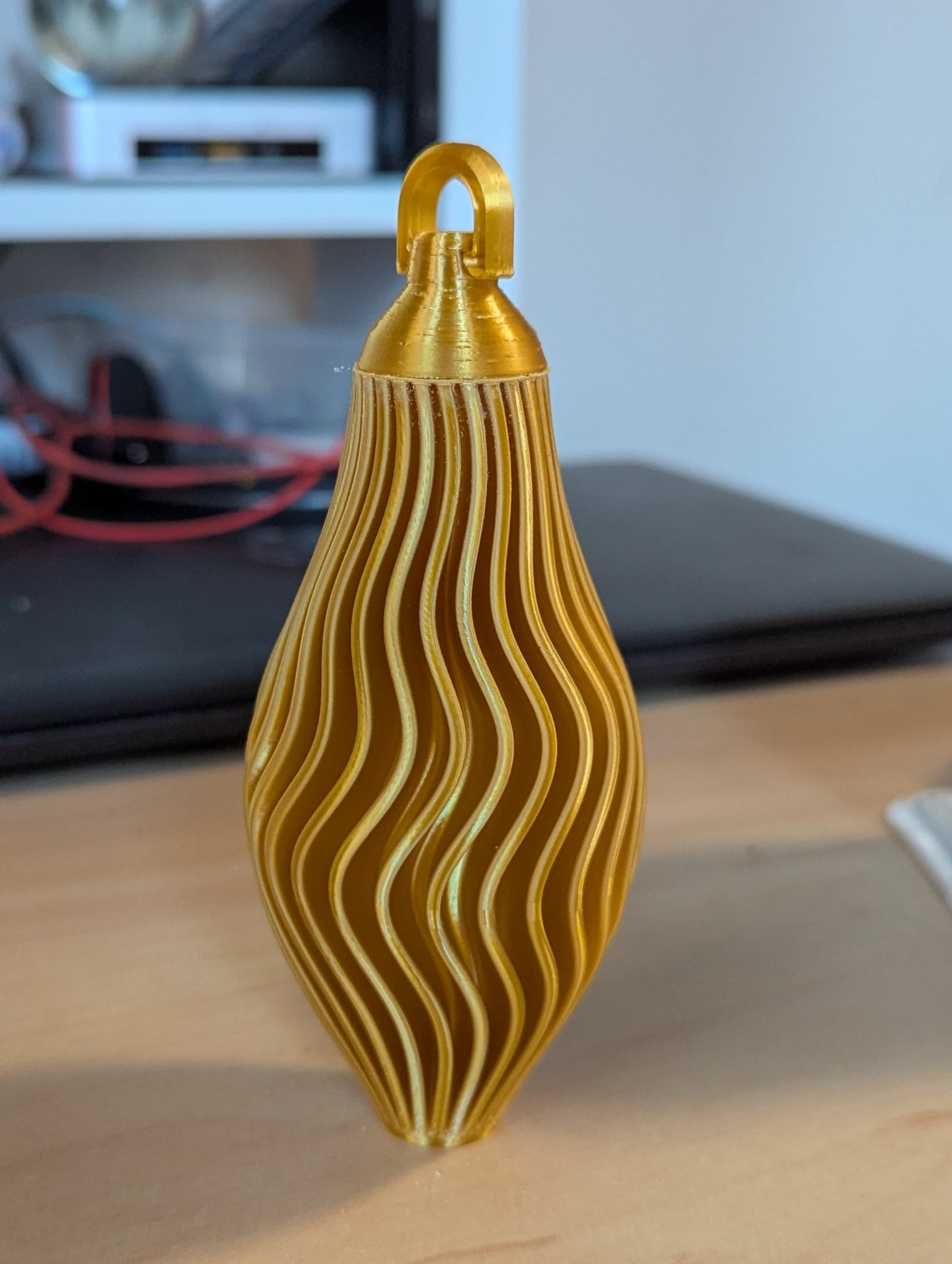 Body printed in Vase mode - 1h to print. Perfect except for the point which went wobbly. Cut off and it looks great anyway.
Cap and hook printed normally and hot glued to body.
Looks great - i will be printing a verity of these for this year's tree.