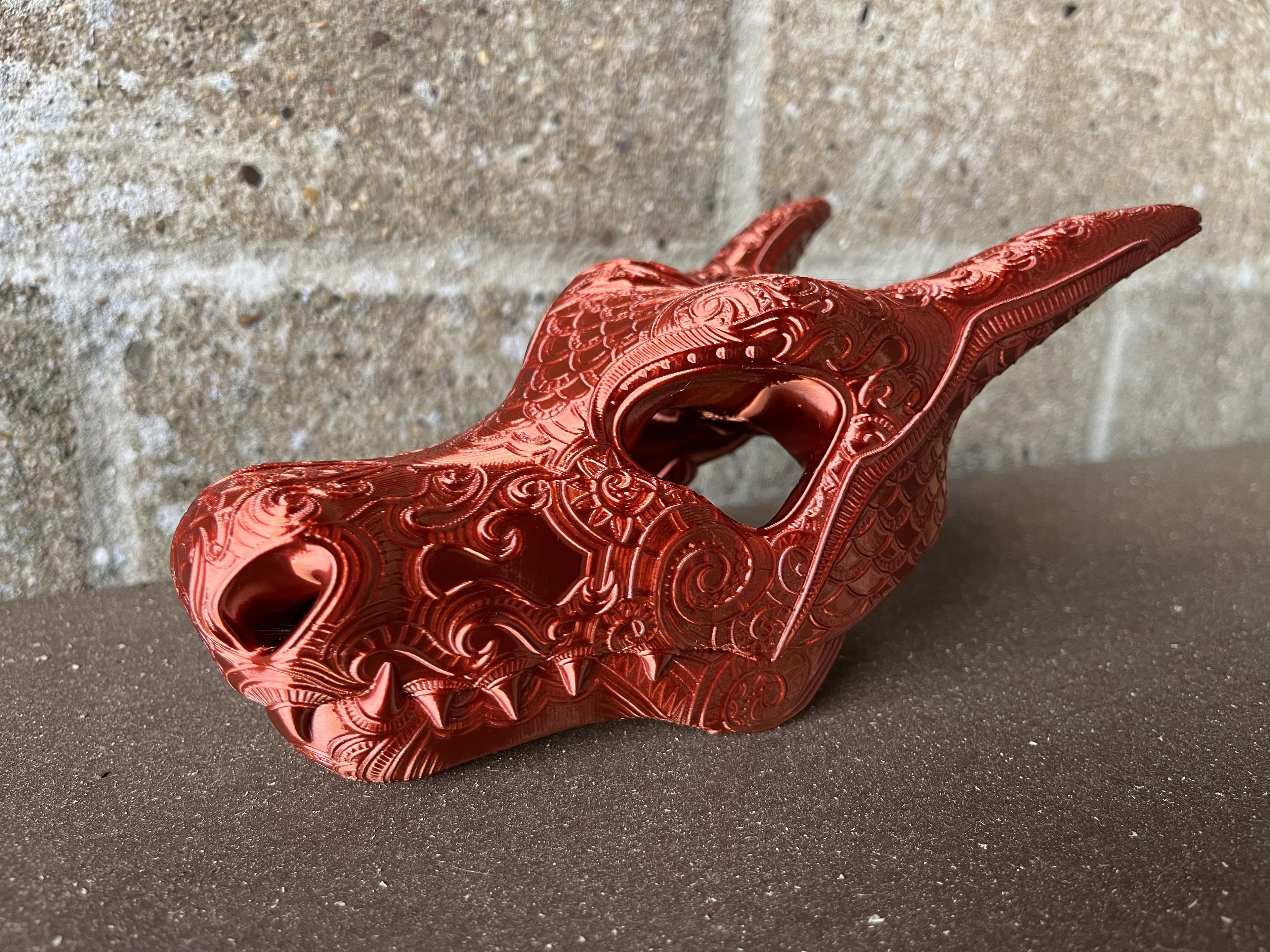 Ornate Charizard Skull (Pokémon) - I saw this after printing the Cubone and had to try this one too. Printed at 0.15mm layer height on Prusa Mini with supports on build plate. Just barely fit at 100%. Used Polyalchemy Copper Elixir PLA. - 3d model