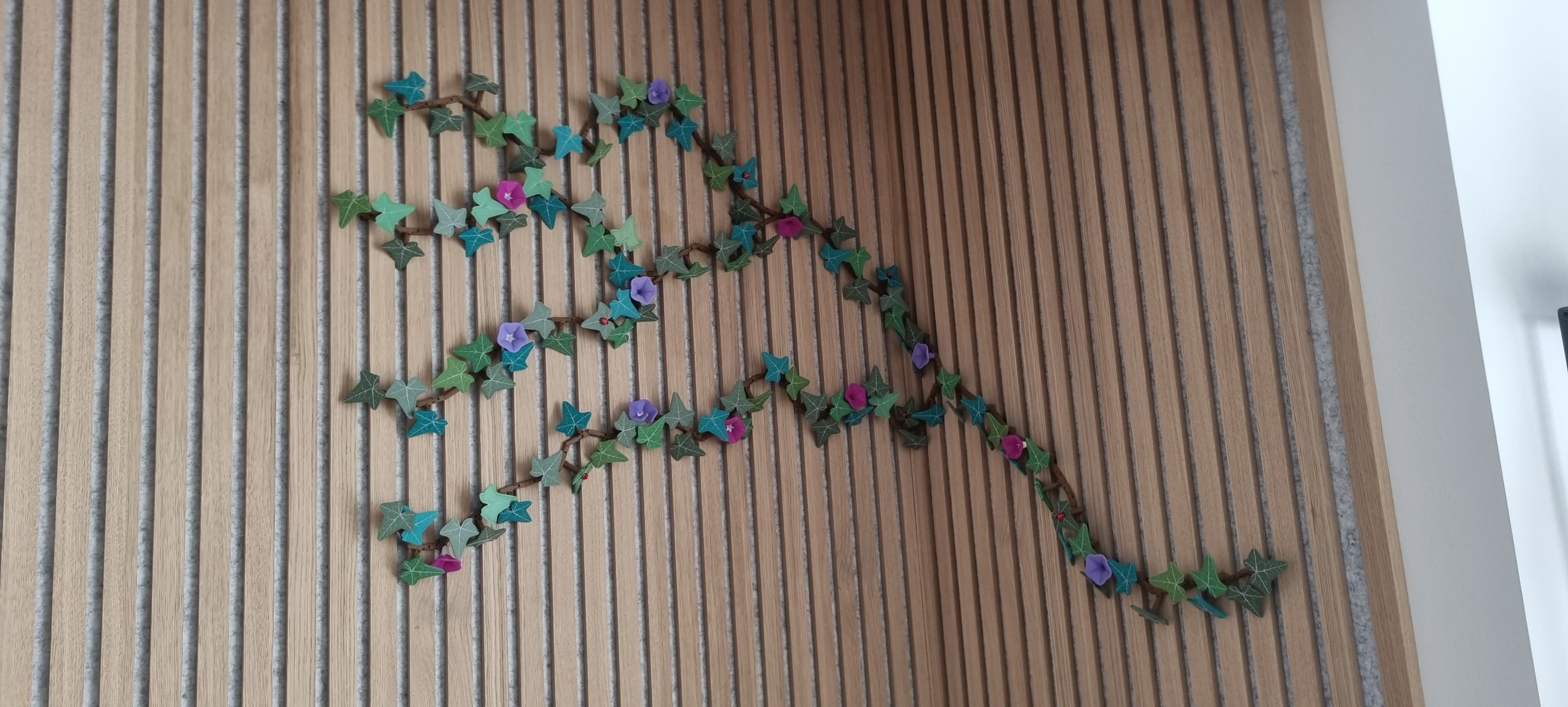 Thank you so much for this beuatyful Ivy :-) It was really fun to print :-D and ot looks really good in our alcove.
It took about 385 magnets to make :p It is fixed to small magnets in the acoustic panels :-) We simply love it :-D