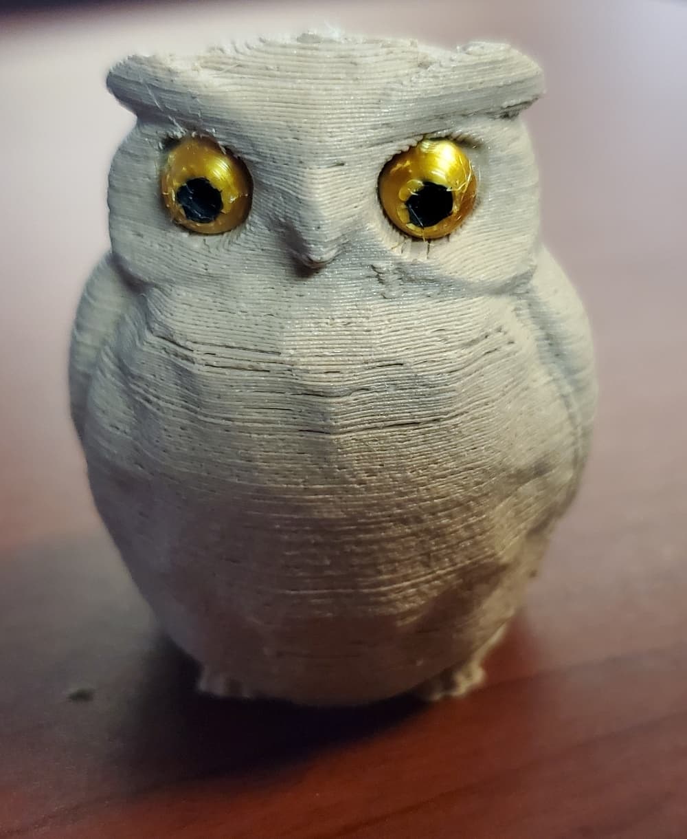Wood pla filament with gold silk metallic pla for the eyes