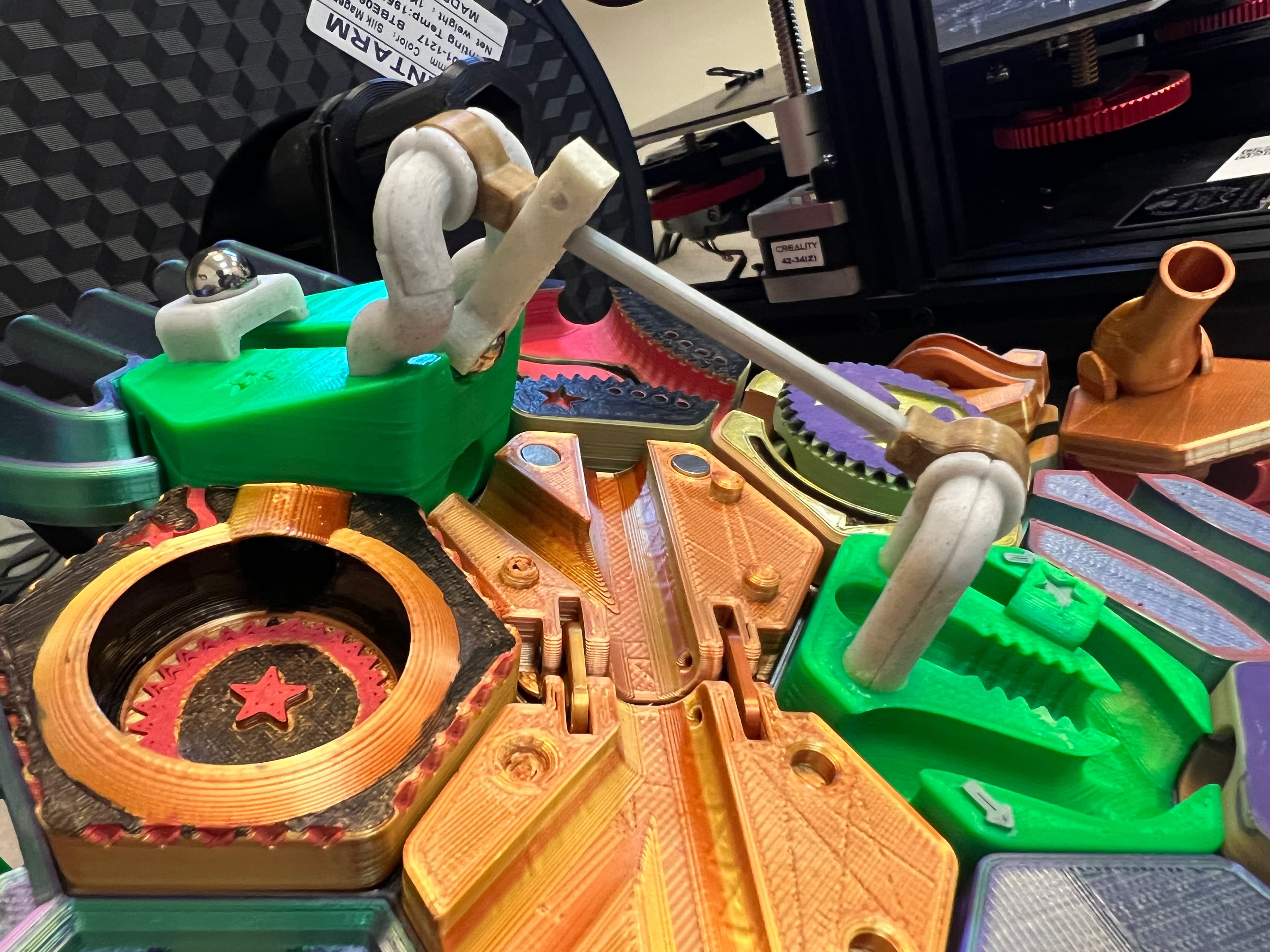 This is without a doubt the most complex 3D print I've printed to date. There was a lot of trial and error in the parts assembly. But boy, howdy is it a fine result! It doesn't always fire correctly, but when it does, it is so very satisfying.
I very much appreciate how the tile was thought through for when it fails or is approached from the wrong direction.
I don't entirely understand the instruction cards, but I've just made house rules to accommodate the functionality.
Thank you so much for this awesome design!
