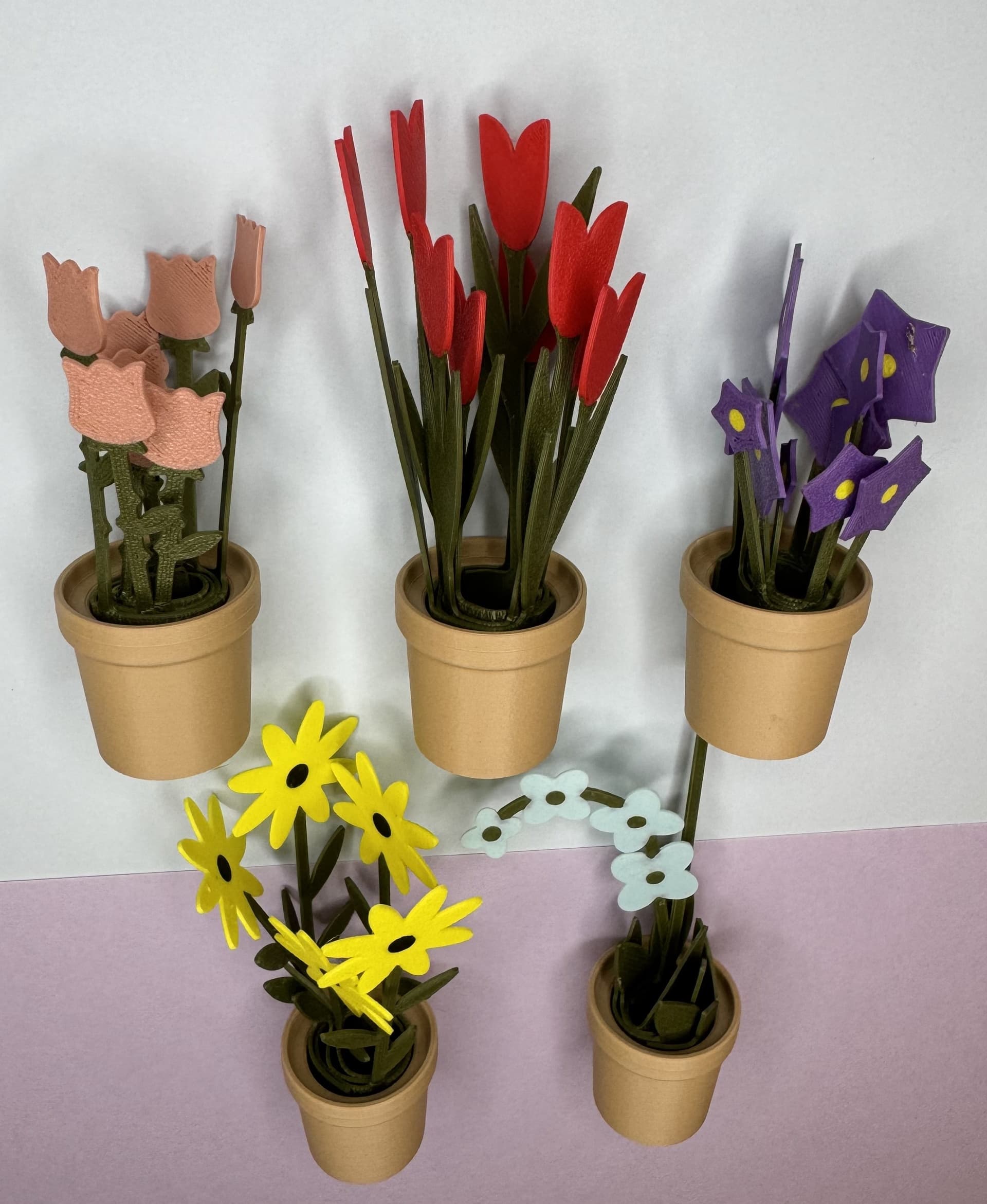 I love your flower pots. I increased the height of the flowers a little, up to 4 layers. They were a bit unstable and broke very easily.
