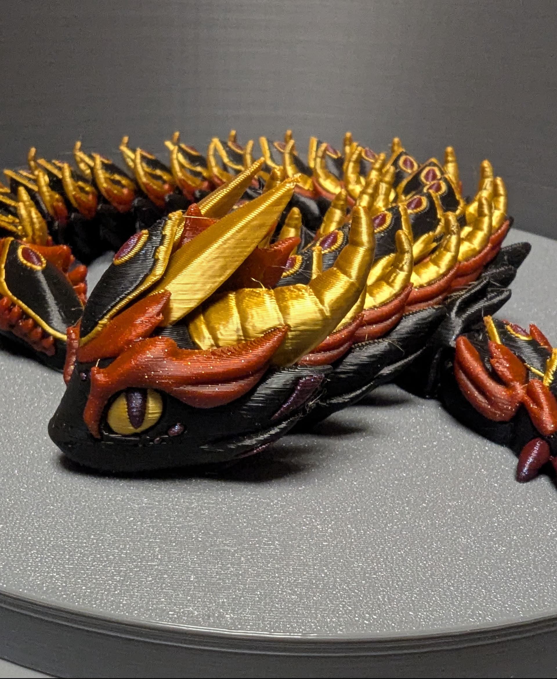 Thank you for the great model Mimetics3d! 90% size, added brim due to previous failure - may not be necessary for you, brim-object gap was set at 0.4mm, relatively easy to remove.
Approximately 24 hrs print time.
My "Blackguard" color scheme:
Geeetech Gold Silk PLA;
Sunlu Meta Black PLA;
Bambu Sparkle Crimson PLA;
Flashforge Marsala PLA.