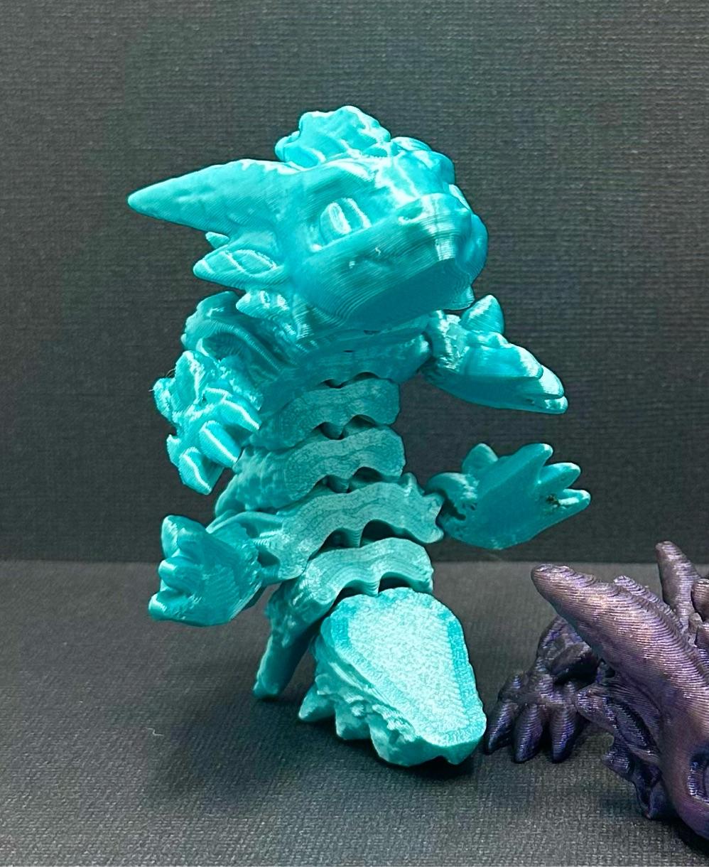 Cold Snap, Winter Dragon Child - Articulated Snap-Flex Fidget (Loose Joints) - Polymaker silk light blue  - 3d model