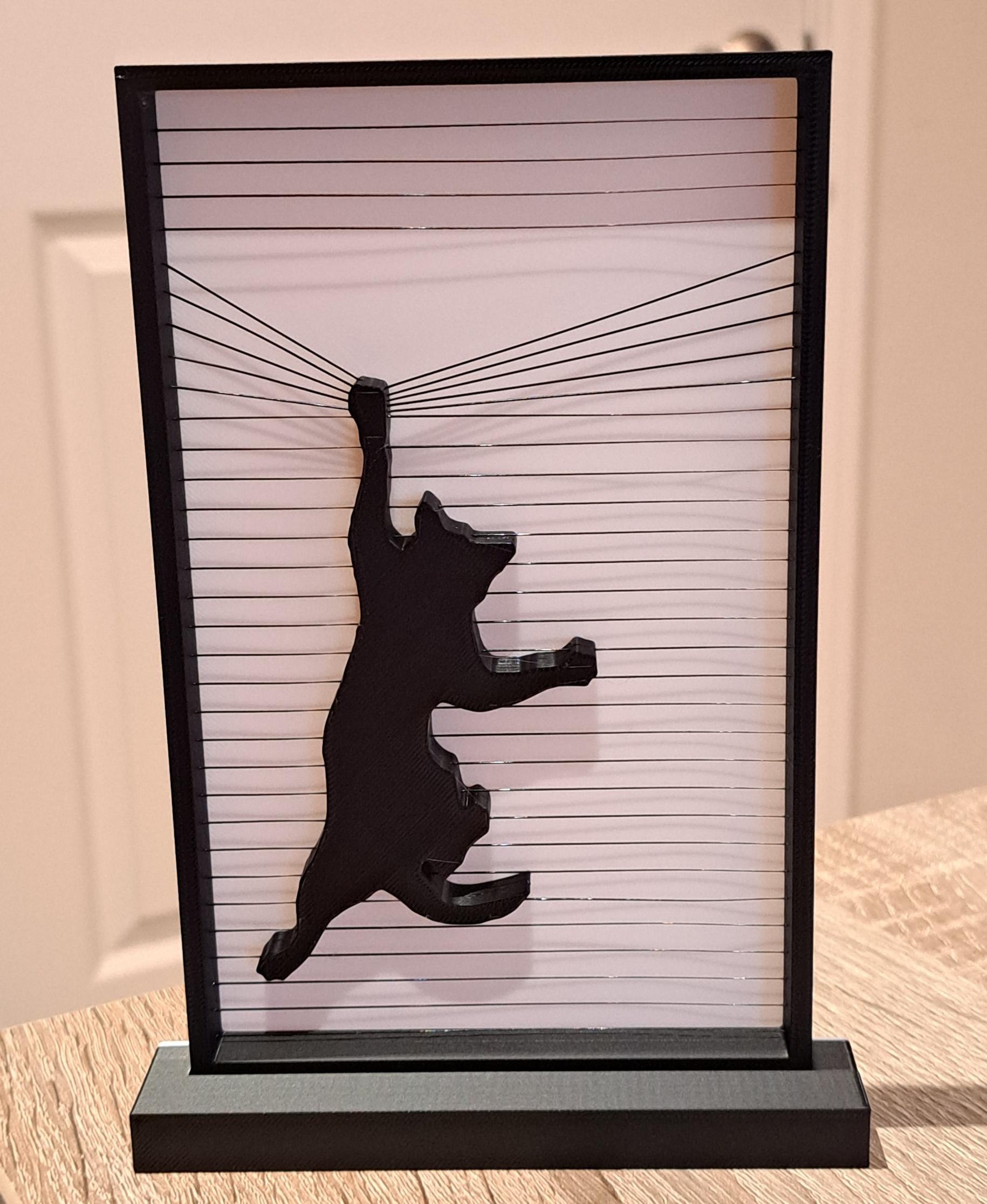 Hanging Cat Ornament - Wife and I have three cats, all of them problem children in one way or another, so I figured she'd appreciate this. Printed on Bambu X1C using SUNLU black and white PLA. - 3d model