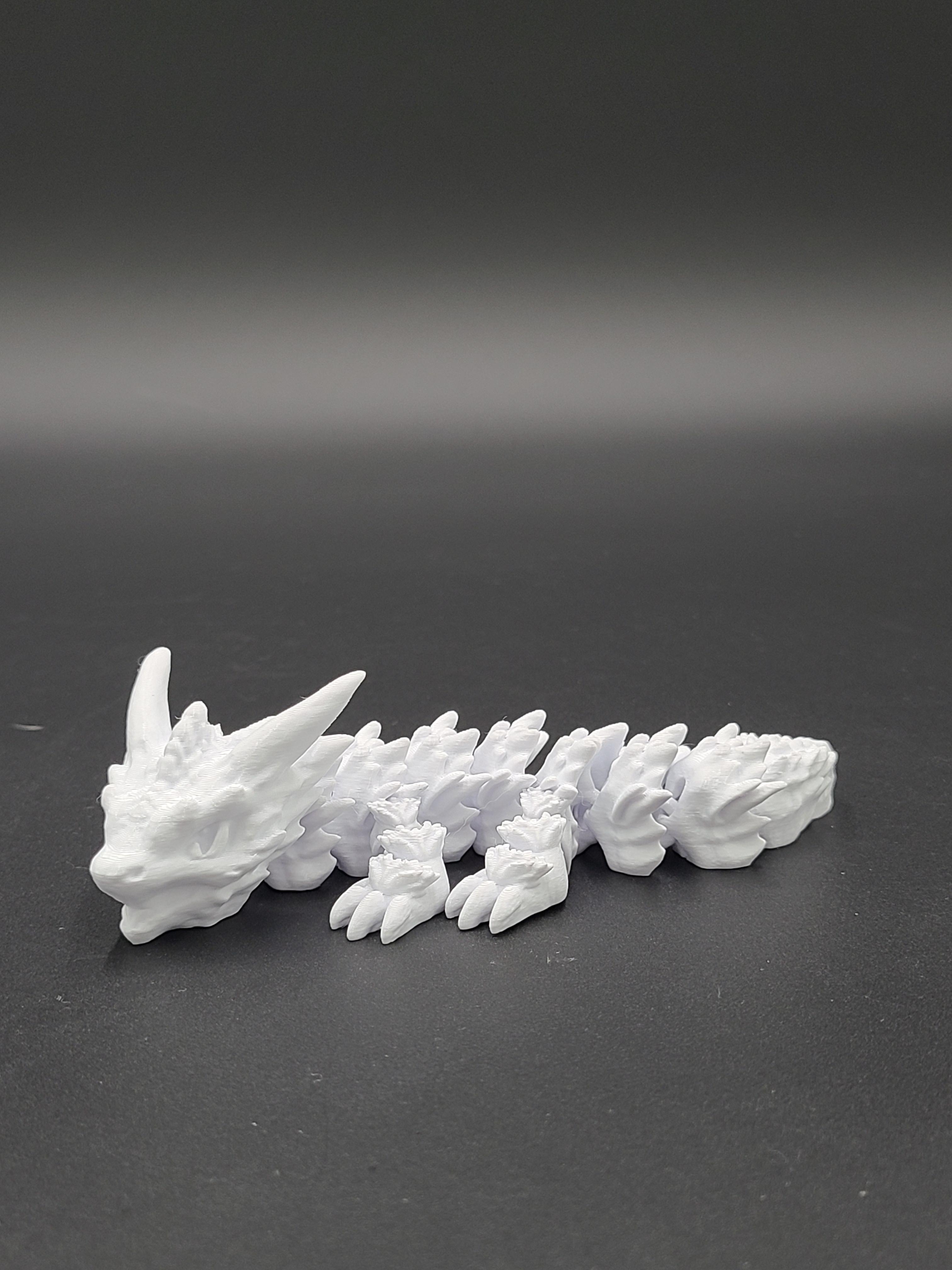 Frostbite, Winter Dragon Child - Articulated Snap-Flex Fidget (Loose Joints) 3d model