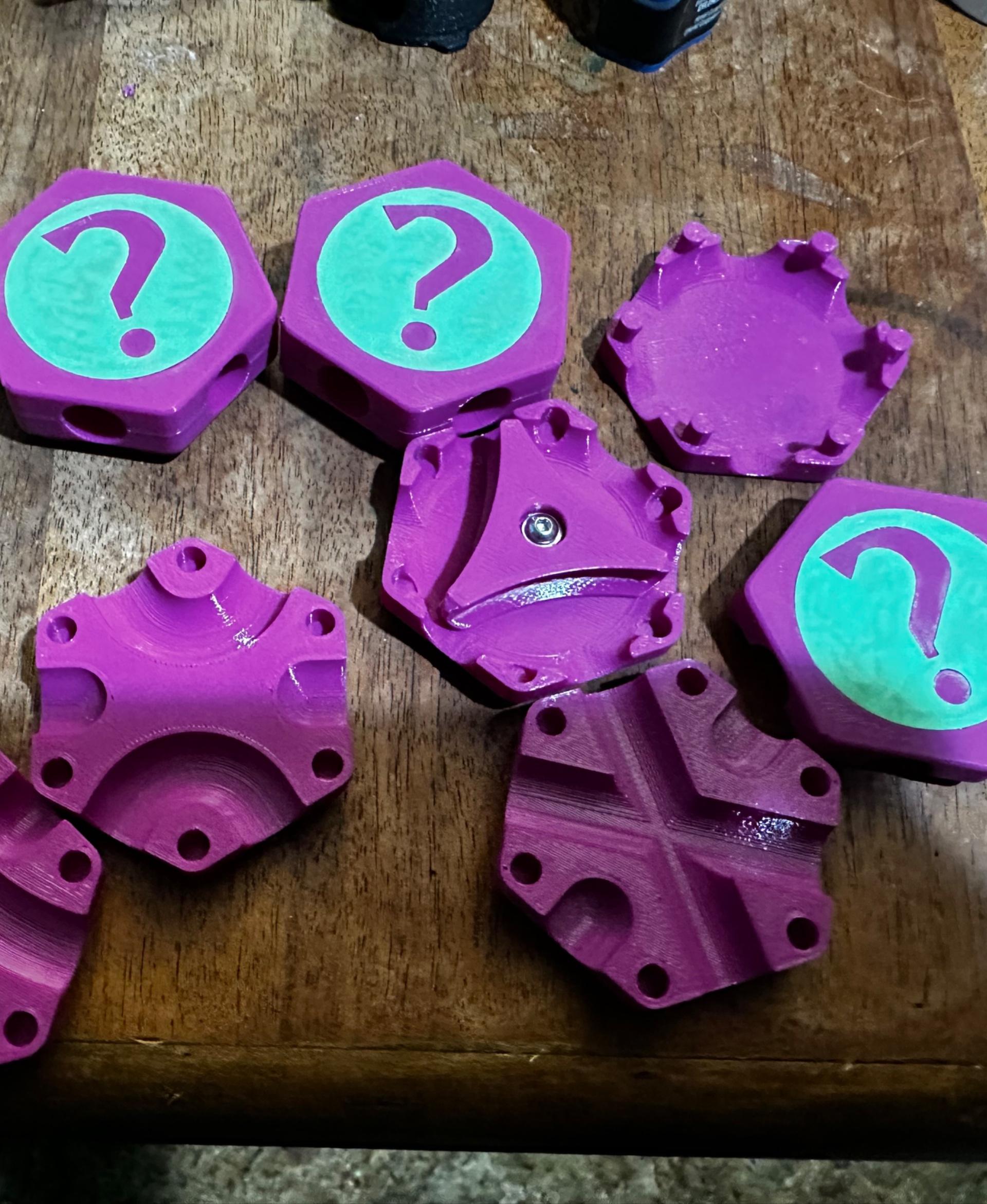 Hextraction Secret Tiles - These were kind of a pain to print.  Thankfully I read through the comments and makes first and learned that the I need to get corrected tile bodies - the X, DC and Flipper tiles all have holes that are too shallow for the cover so I used these corrected models:

DC, X - https://thangs.com/designer/johnlattanzio98/3d-model/FIXED%20Secret%20Hextraction%20Tiles-878686

Flipper - https://thangs.com/designer/timothyjackman/3d-model/Fixed%20Hextraction%20Secret%20Flipper%20Tile-884171

For the cover - I printed them with the "top" (the question mark) down, and used supports.  Then, I shrunk the inlay down to .4mm thick instead of .6mm, that way they fit in nicely when I glued them in.  Looking forward to getting my MMU3 unit so I can reprint these in multicolor without gluing the inlays in. - 3d model